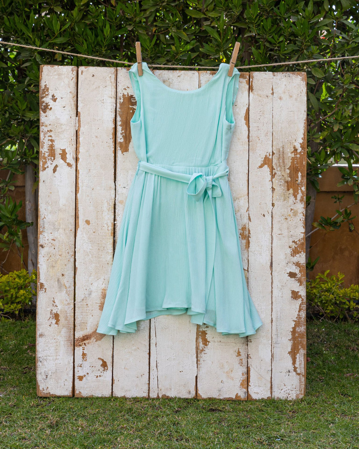 Mint ruffle backless dress in textured fabric