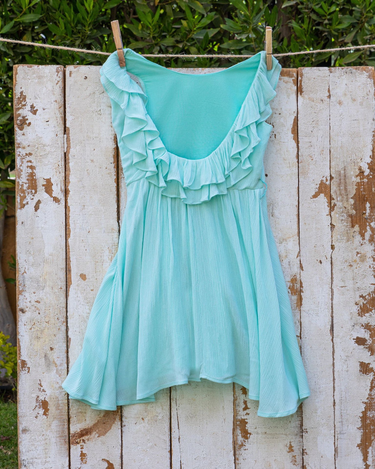 Mint ruffle backless dress in textured fabric
