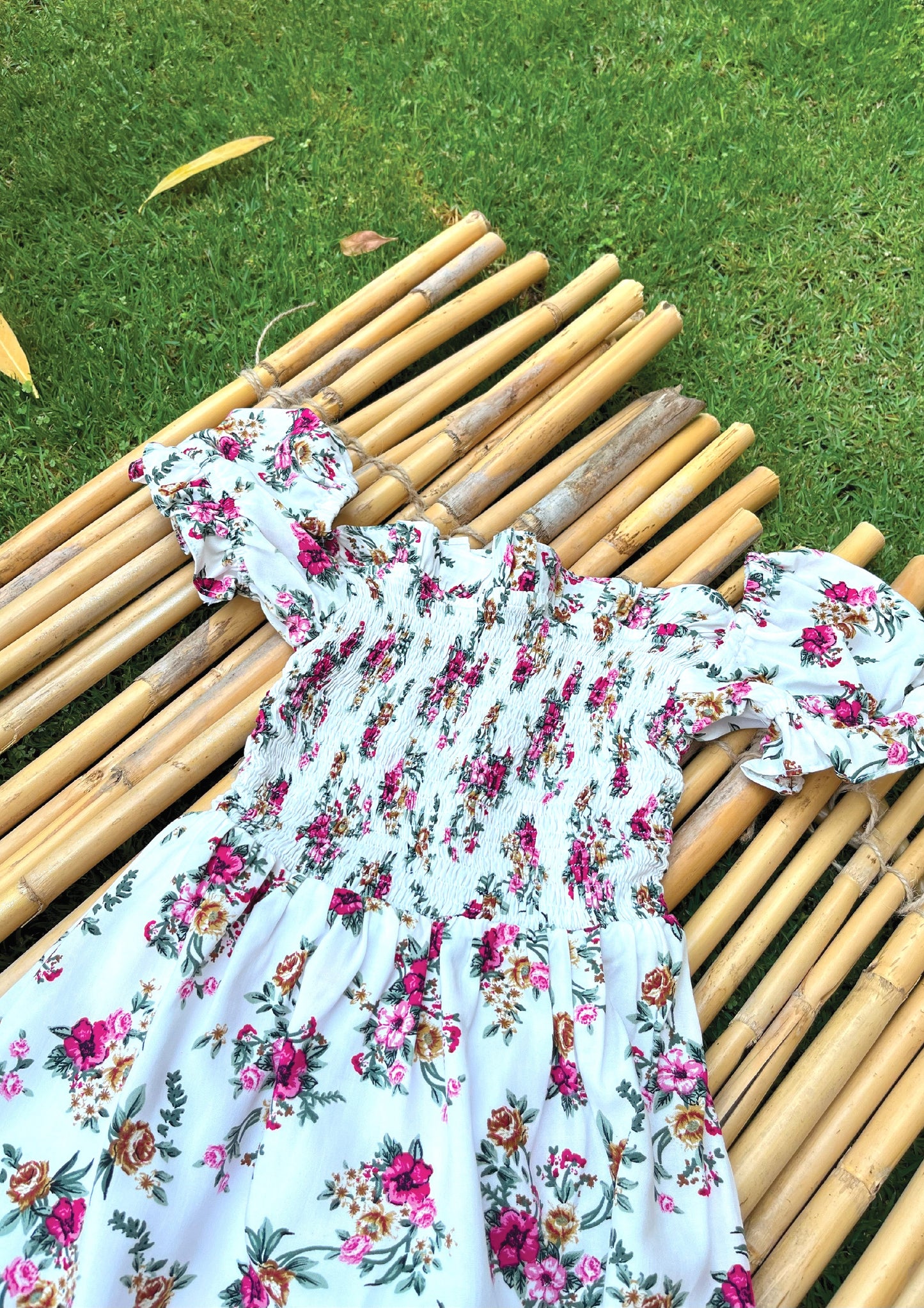 Floral smocked dress in white